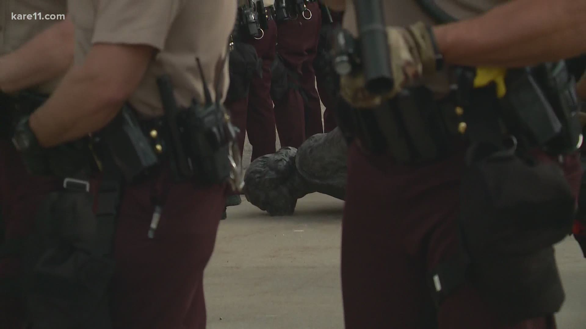 Protesters toppled the statue before State Troopers surrounded it.