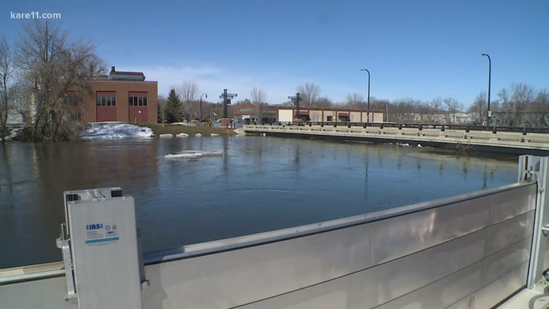 The Crow river's levels are projected to be under flood wall levels but city officials say they are putting the walls up to protect against ice-jam-caused floods.