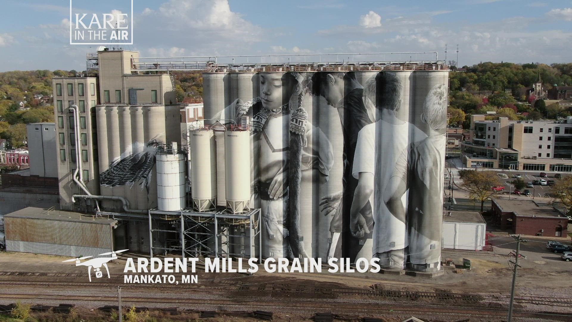 Australian artist Guido Van Helten has painted murals all over the globe, but in 2019 he began working on eight 135-foot tall silos at the old Ardent Mills site.