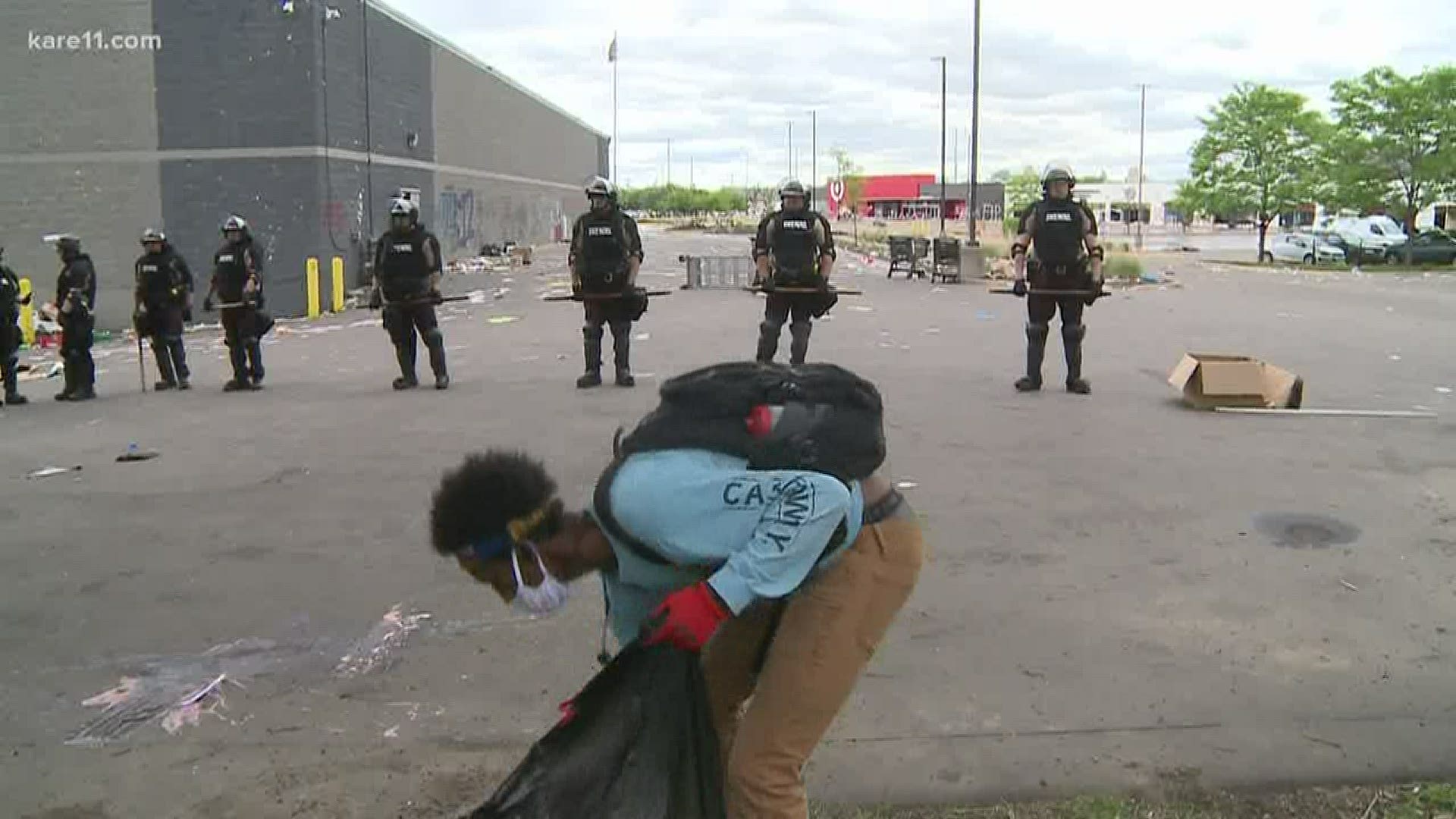 Volunteers clean up after another night of riots in the Twin Cities.