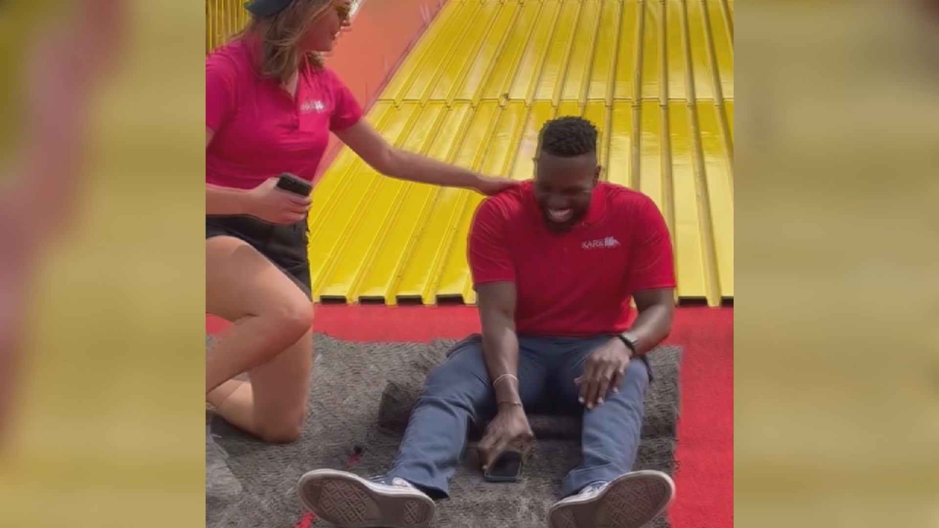 KARE 11 Sunrise anchors Jason Hackett and Alicia Lewis ride the Giant Slide at the Minnesota State Fair.