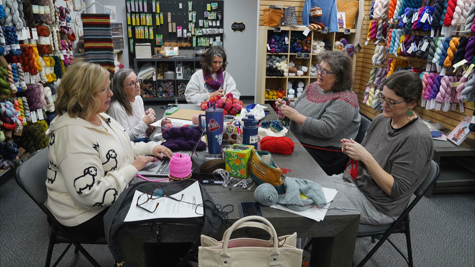 Yarn shop's red hat moves the needle, raising $700,000+ to help ...