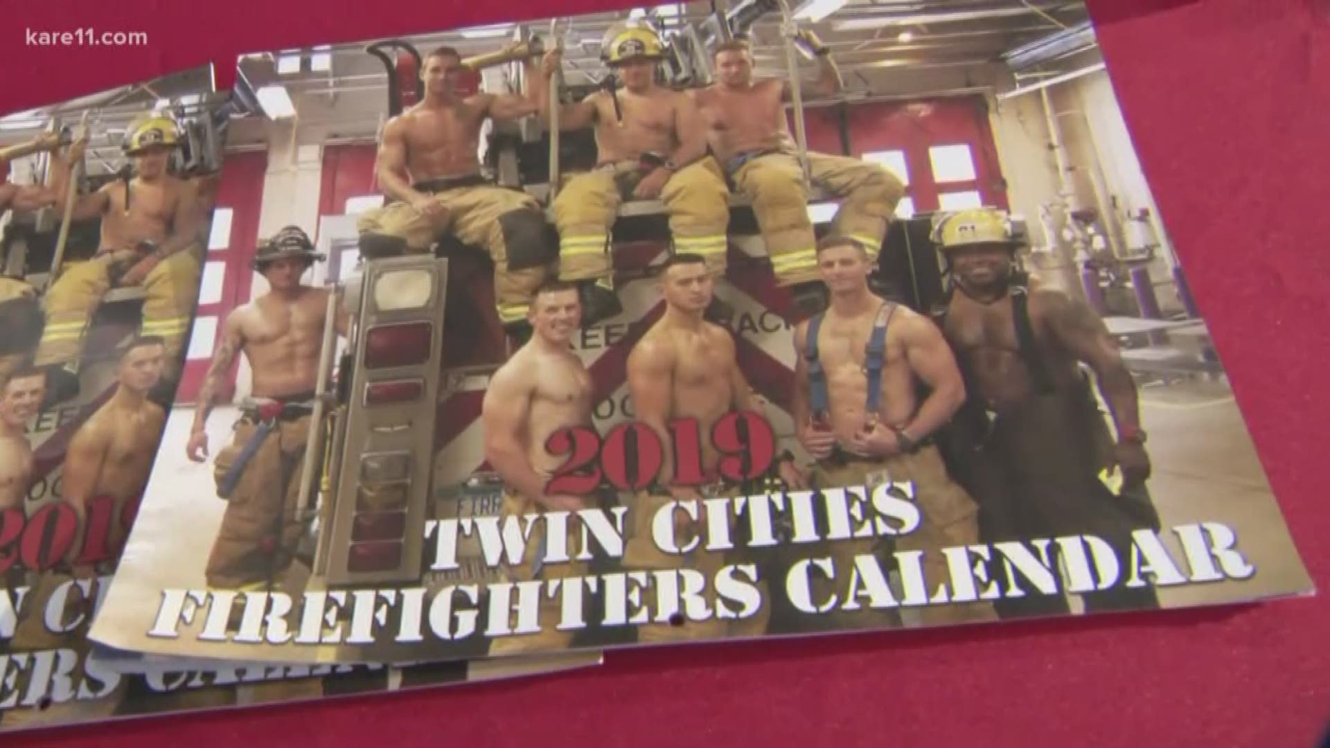 We are at the Minneapolis Holiday Boutique in US Bank Stadium, where you can get a Midwest Firefighters Calendar. When you buy a calendar, your cash will go towards providing new coats to local children.