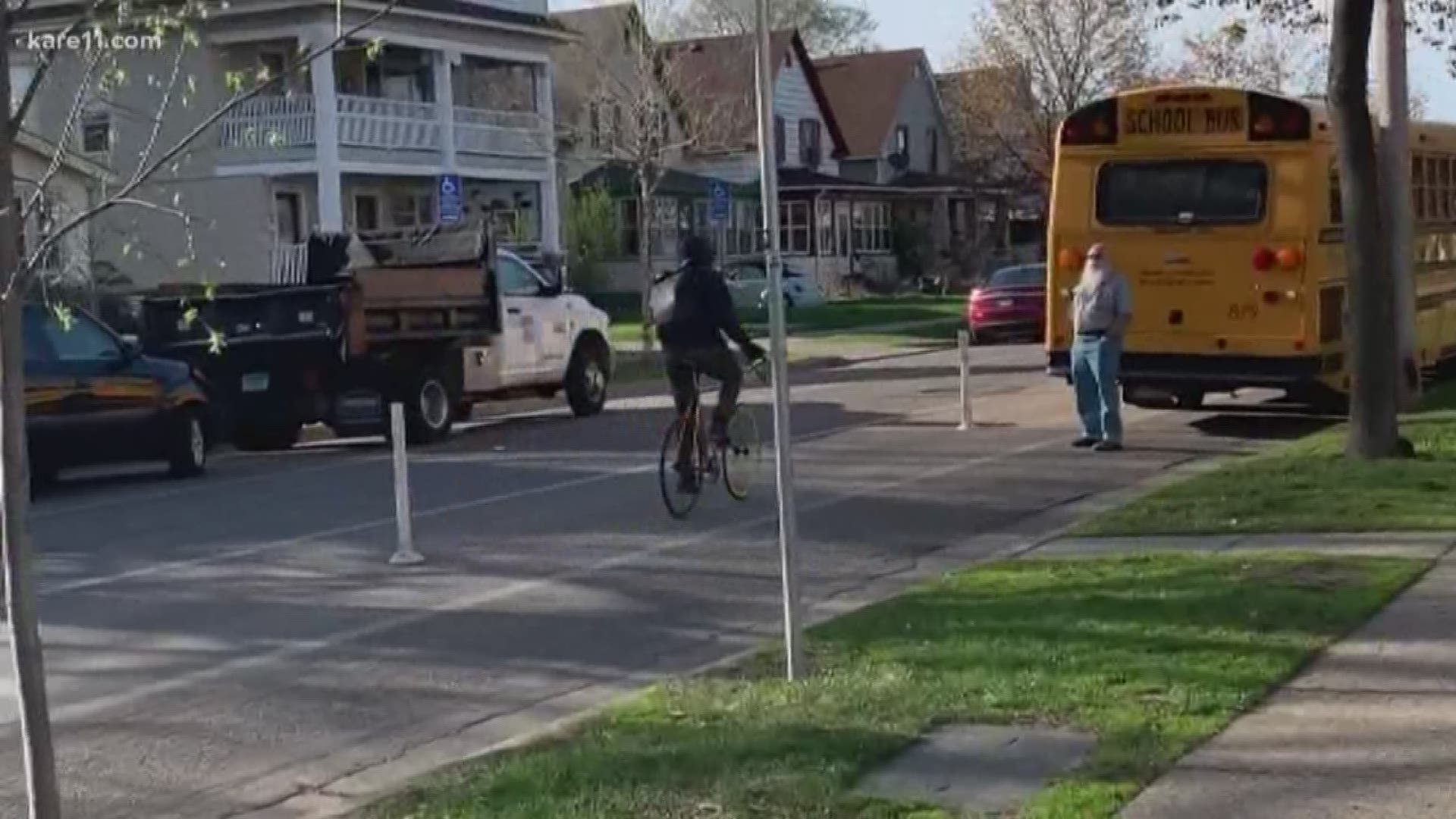A south Minneapolis mom captures on video a bicyclist hitting a parked school bus with his bike lock. The same bicyclist broke several windows on the bus Friday.