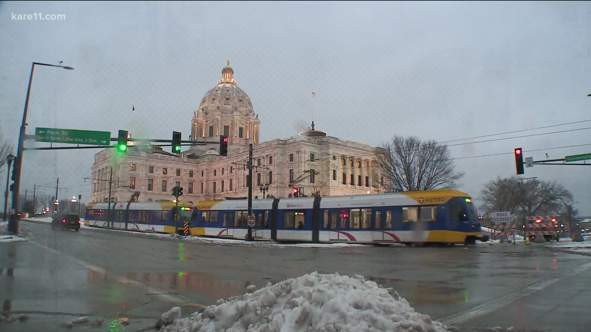 File:Snow falls on a COVID-19 Stay Safe sign in St Paul, Minnesota