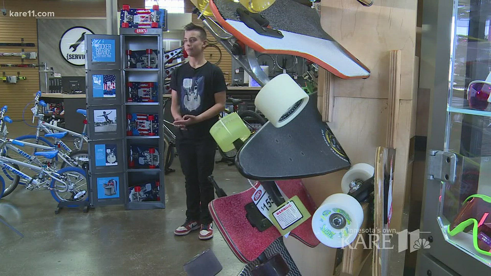 Erik of 'Erik's Bike Shop' welcomes young skateboard inventor