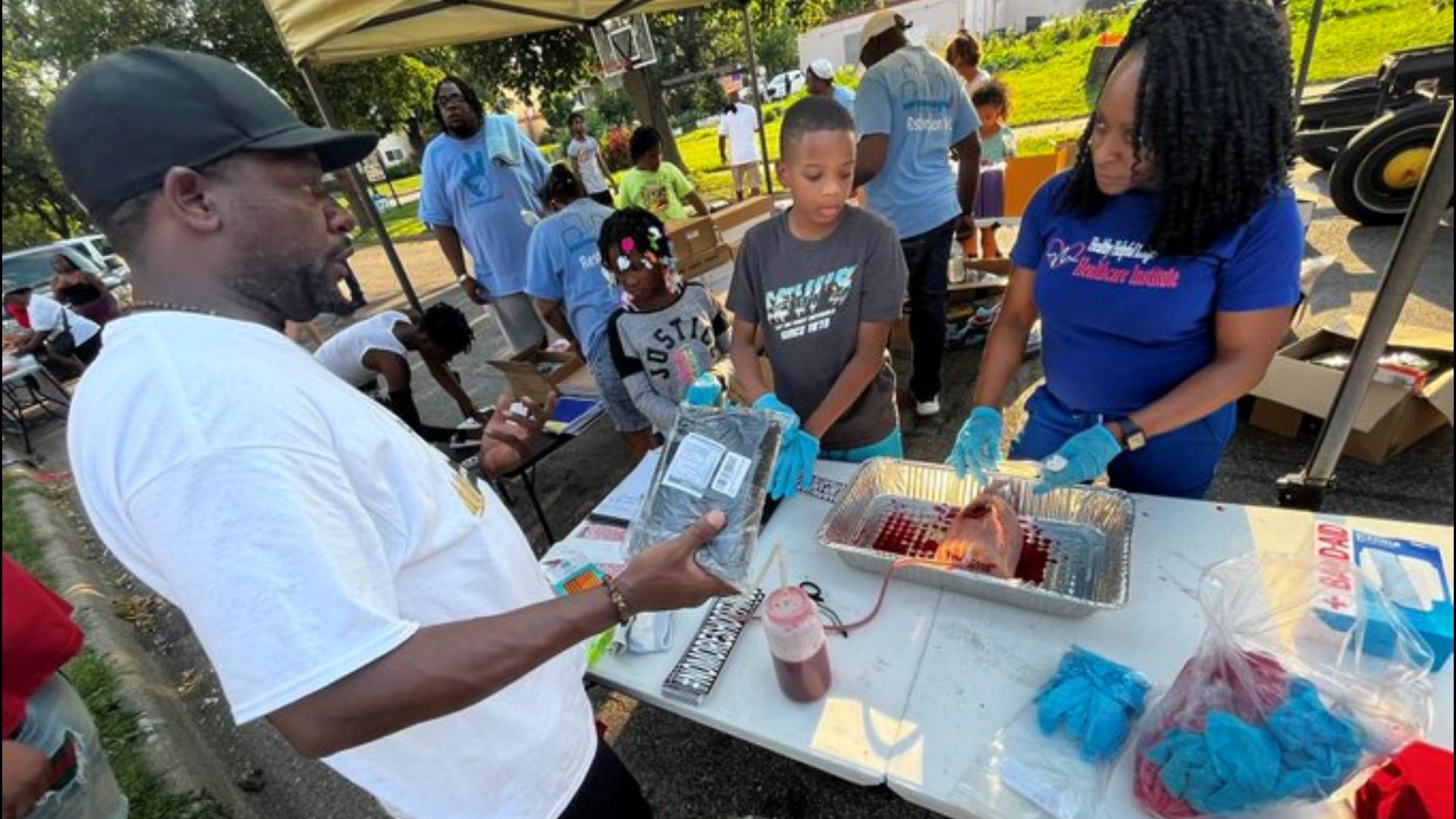 In addition to popular block party events like cooking out, bounce houses and school supply giveaways, there were also free medical supplies and training.