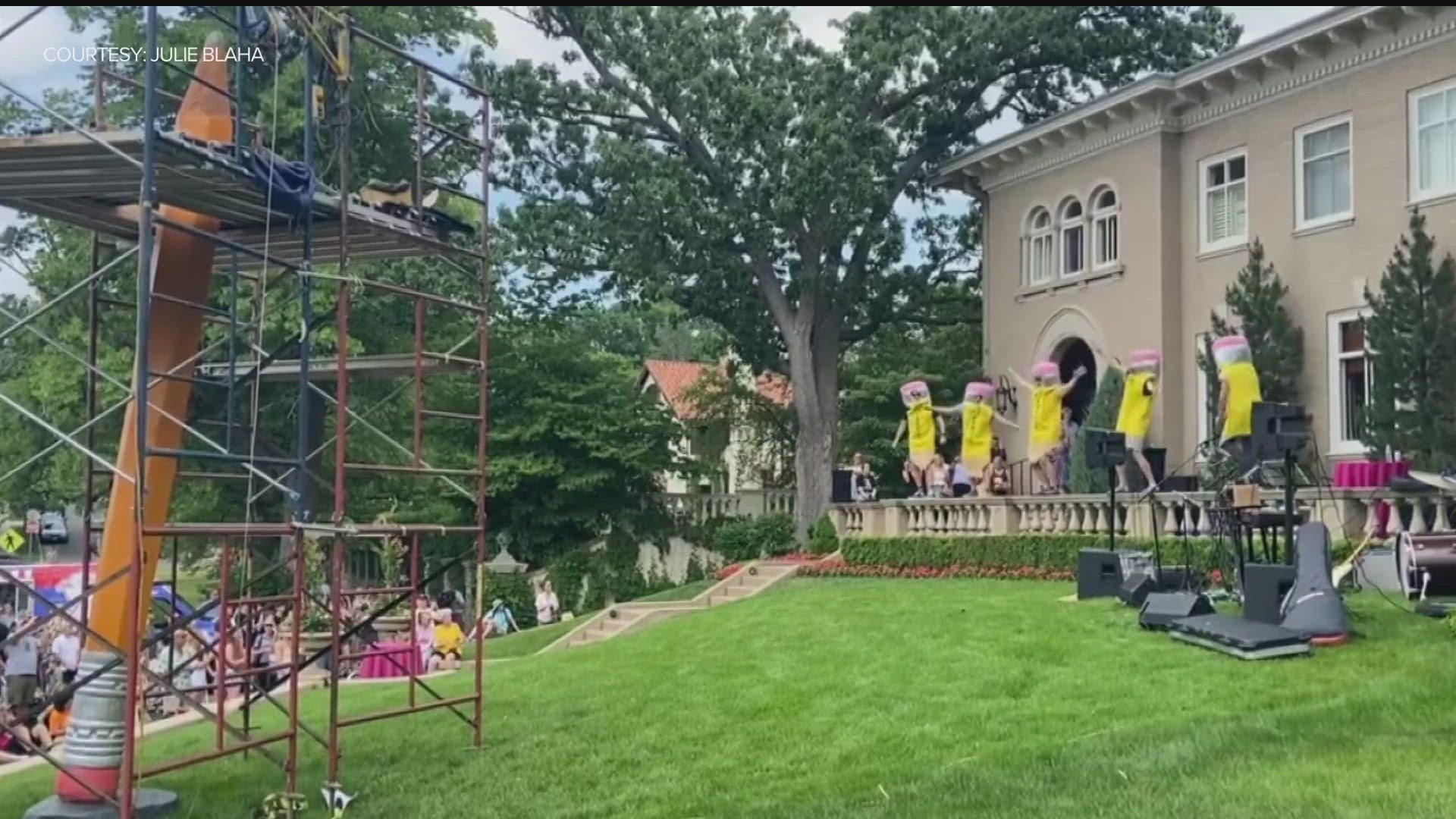 A crowd gathered Saturday for the ceremonial 'sharpening' of Loti Pencil, Curtis Ingvoldstad's giant pencil sculpture at the Higgins house on Lake of the Isles.