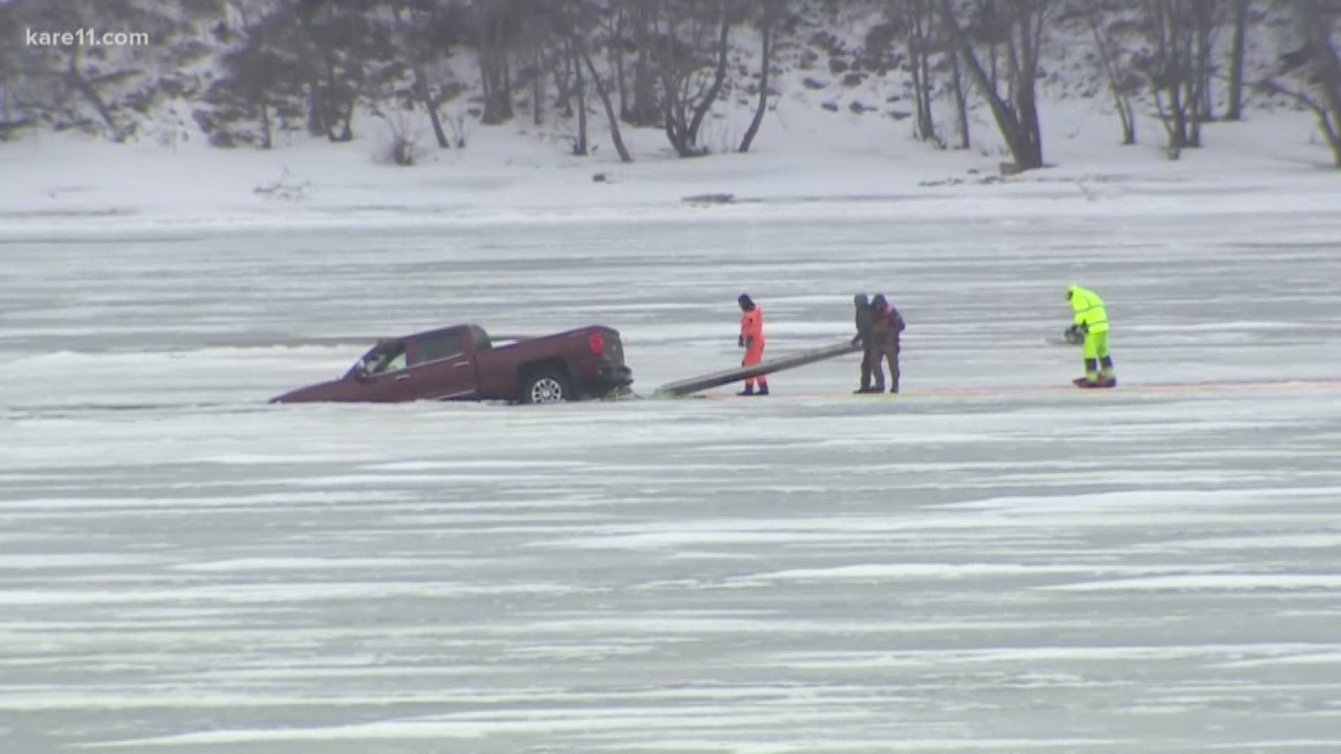 A rescue crew with cold water suits went out onto the ice, entered the water and pulled the driver out of the vehicle with a rescue rope.