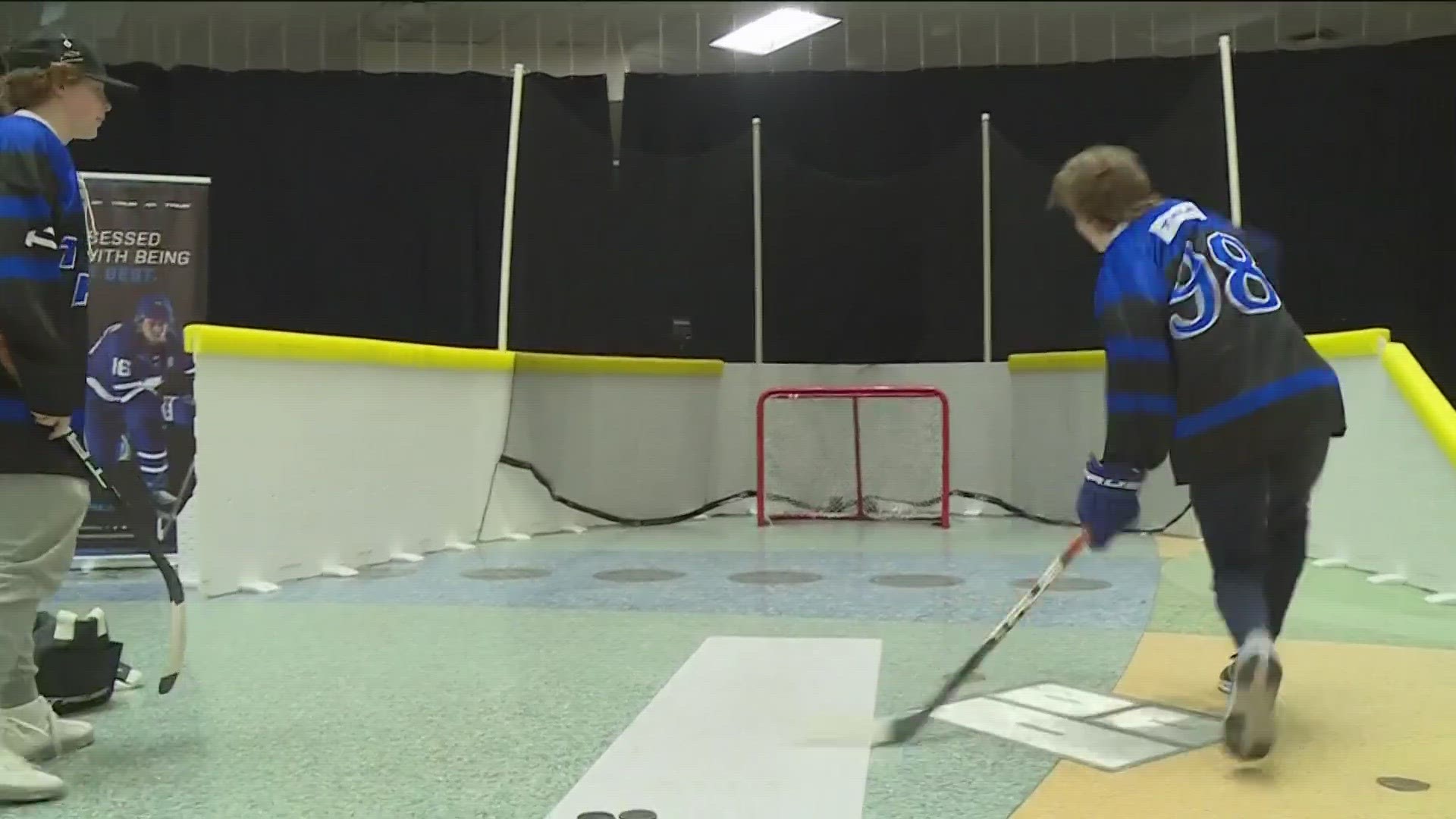 Among other hockey experiences, the Expo features an interactive game that tests the hockey skills of kids and adults.