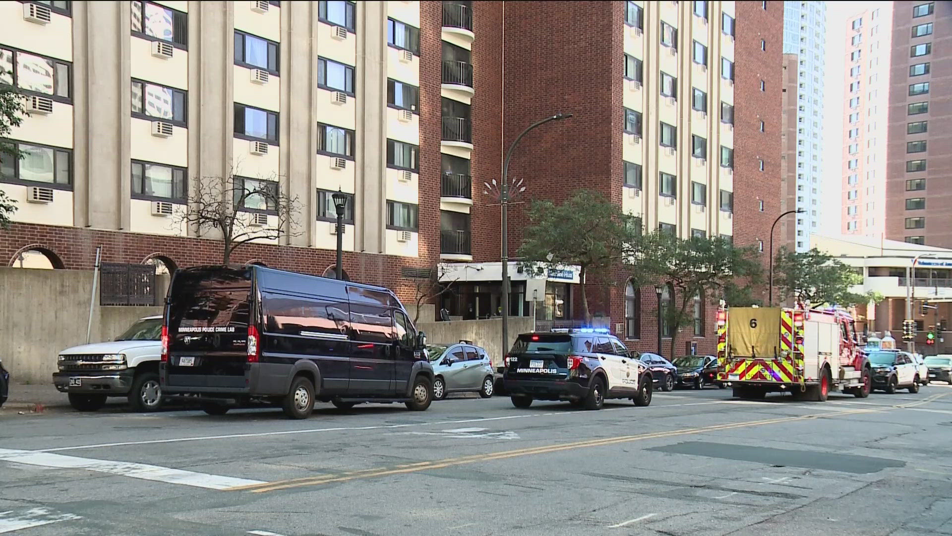 Two men are dead after a shooting at the Loring Towers in Minneapolis, with the suspect in custody. 