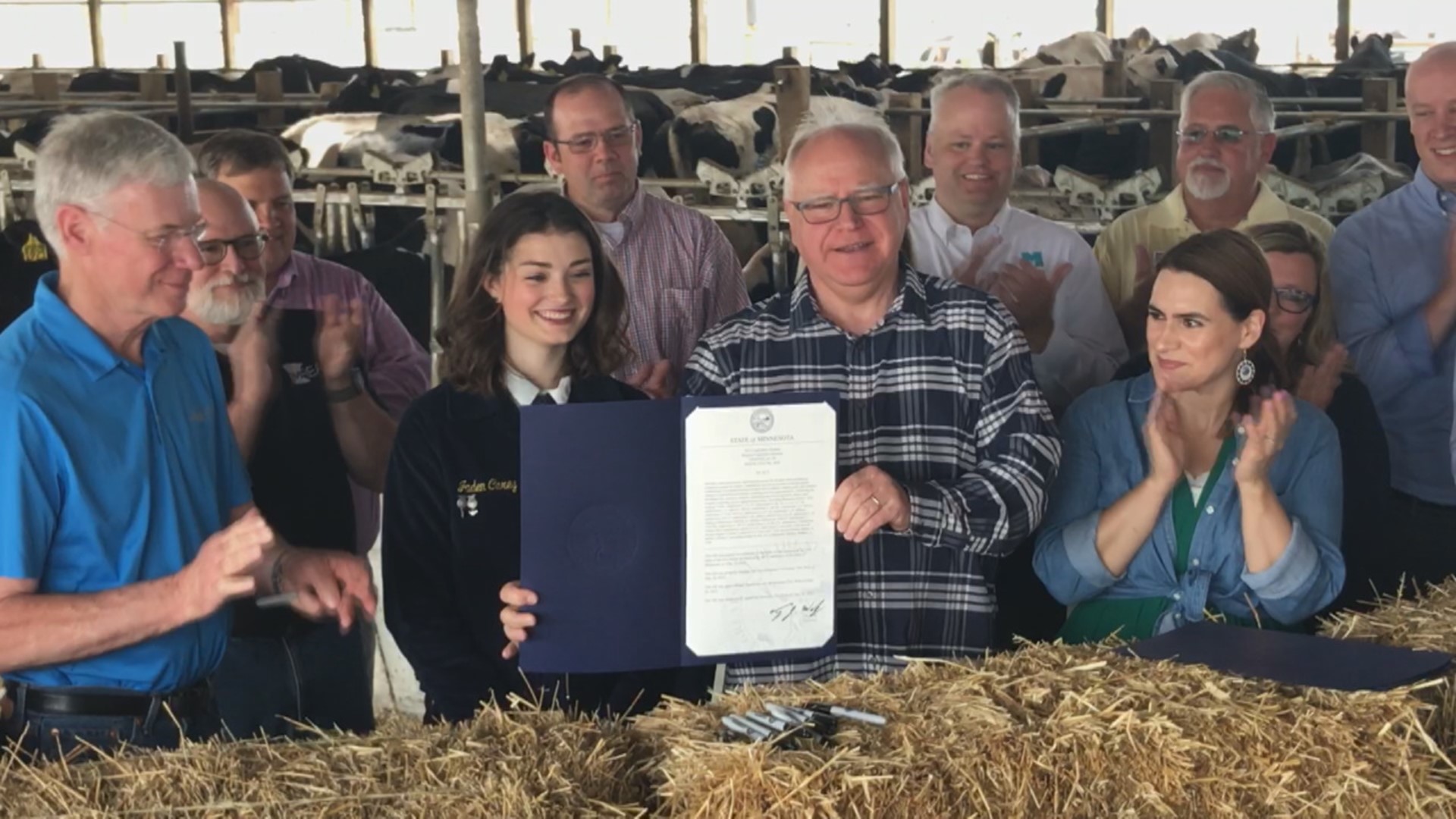 Governor Tim Walz and lawmakers met for a ceremonial signing at a dairy farm in Foley, Minnesota to highlight one of the items that did get done in the 2022 session.