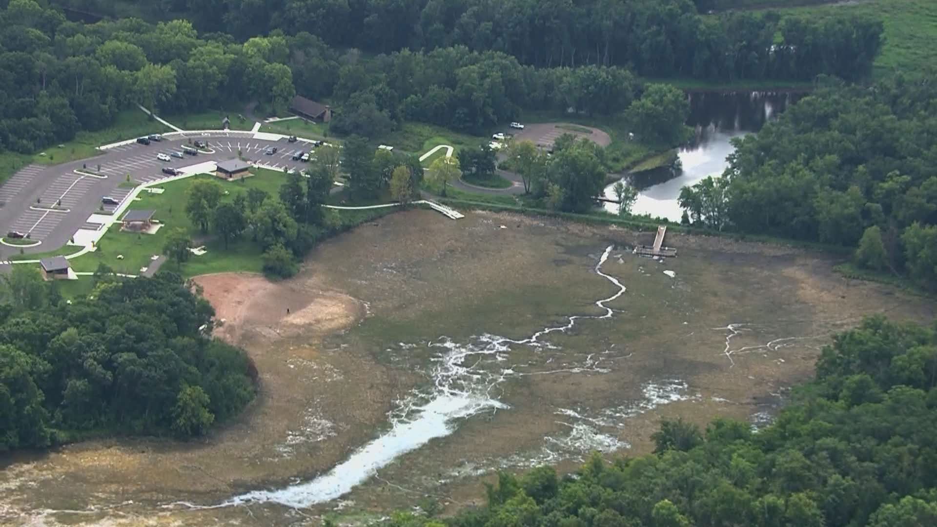 The Minnesota DNR says only a stream remains of what was once the 26-acre, 9-foot deep Lake Alice, and the unplanned draw-down has also caused a fish kill.