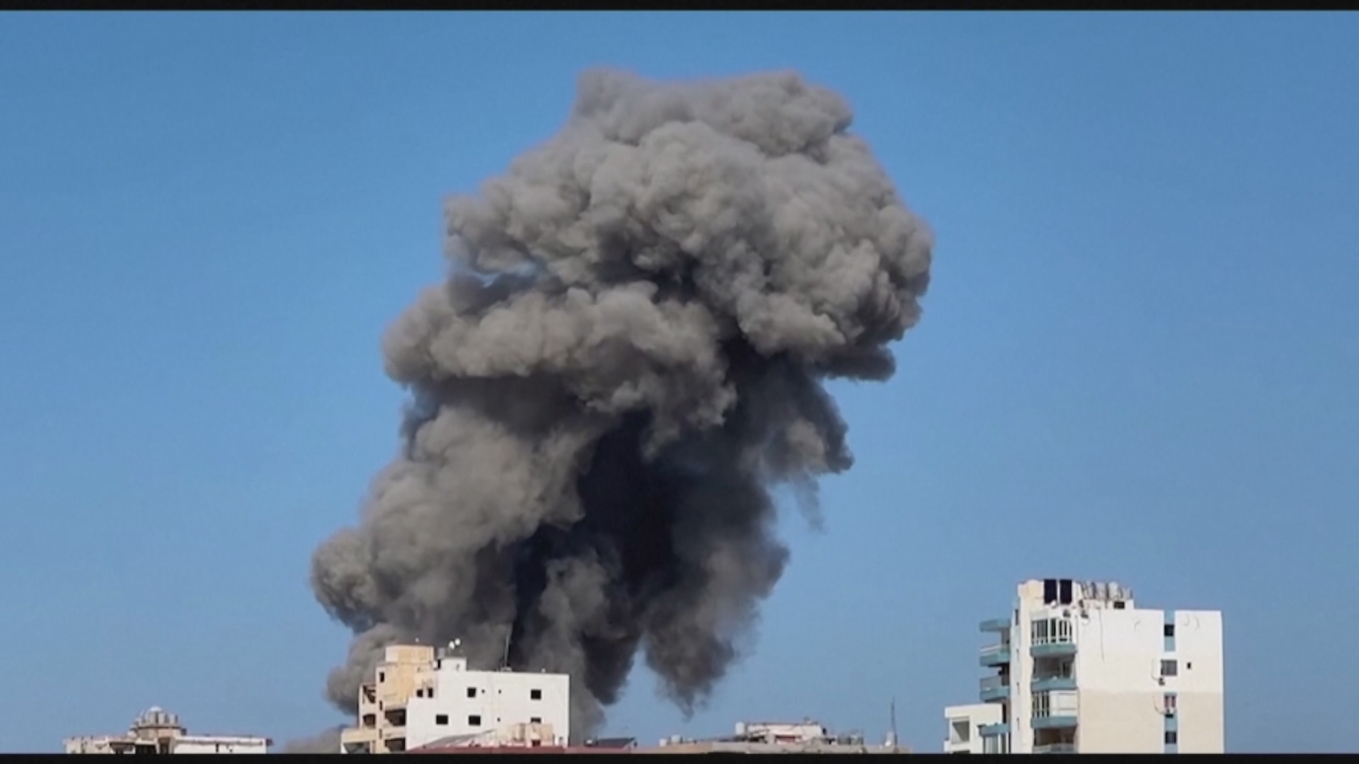 Israeli jets struck multiple buildings in Lebanon's southern coastal city of Tyre today, sending large clouds of black smoke into the air.