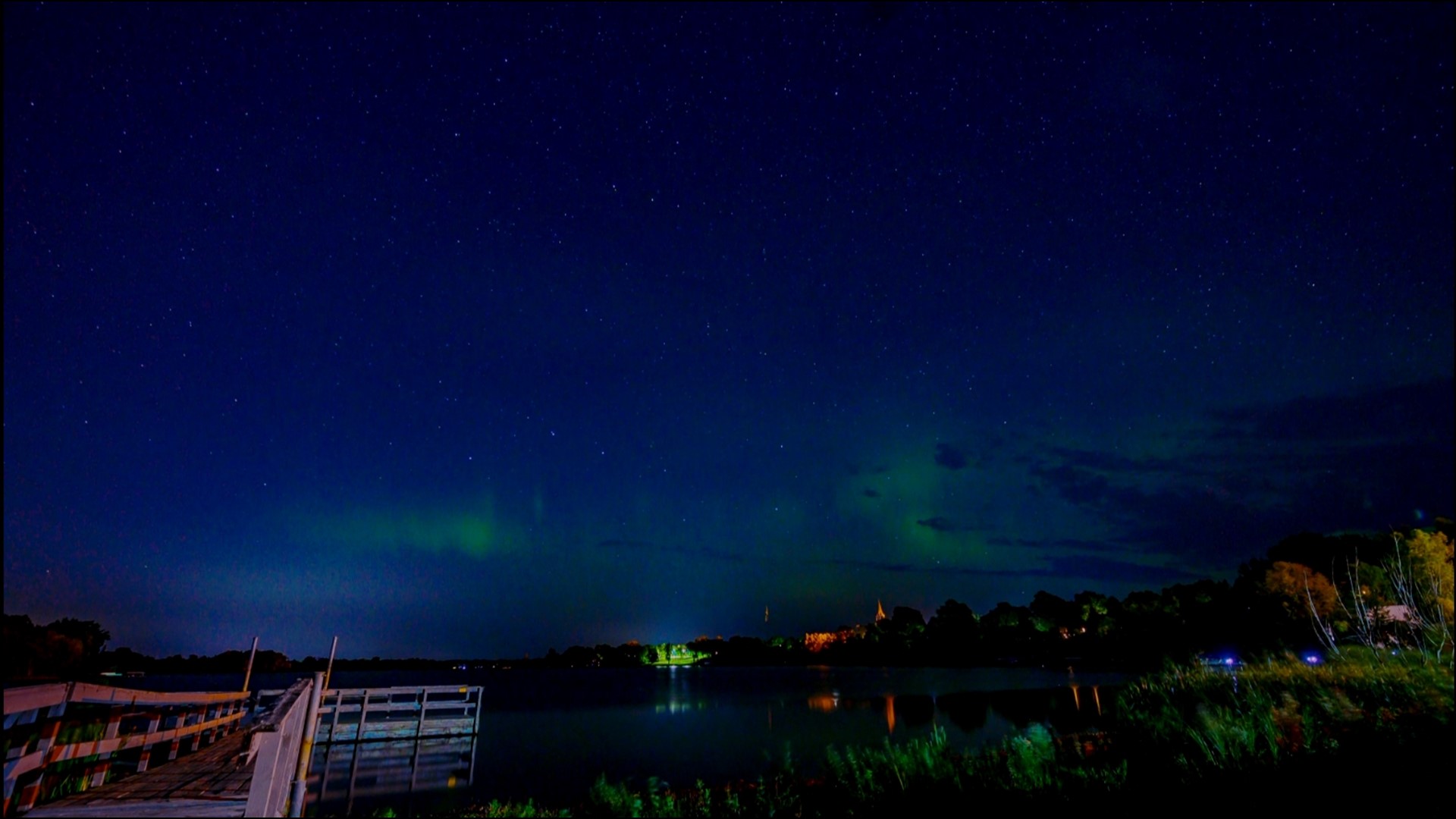 Watch the northern lights dance across the lake near Lindstrom, Minnesota.