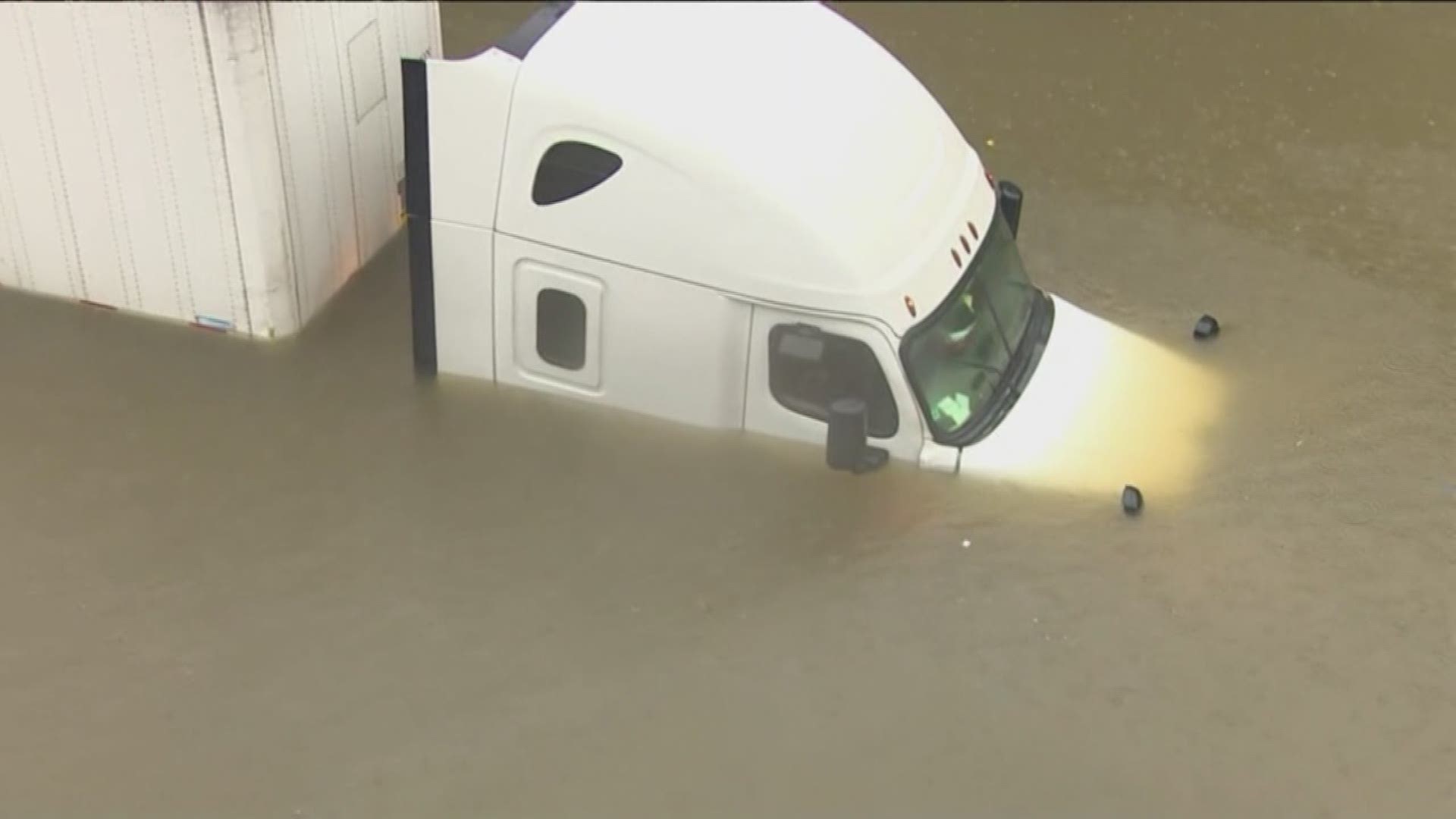KHOU 11 reporter Brandi Smith and photographer Mario Sandoval helped rescue a truck driver who was trapped in floodwaters in north Houston. (Note: Video ends before the rescue.)