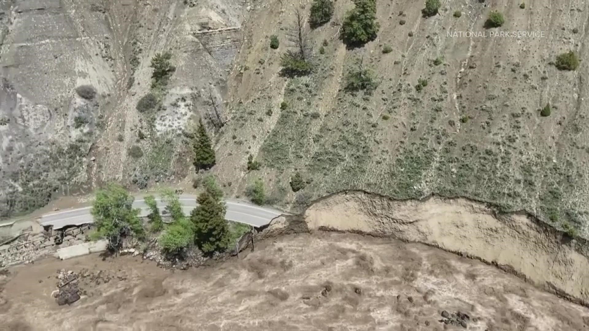 National Park Service helicopter video shows flooding damage on the road between Mammoth Hot Springs and Gardiner, Montana.